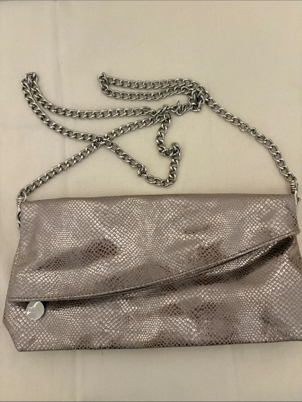 Mark. Metallic Taupe Snake-Embossed Mesh Clutch with detachable silver chain